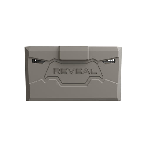 A gray rectangular lithium battery pack with the brand name 'REVEAL' embossed in the center, shown against a plain white background.