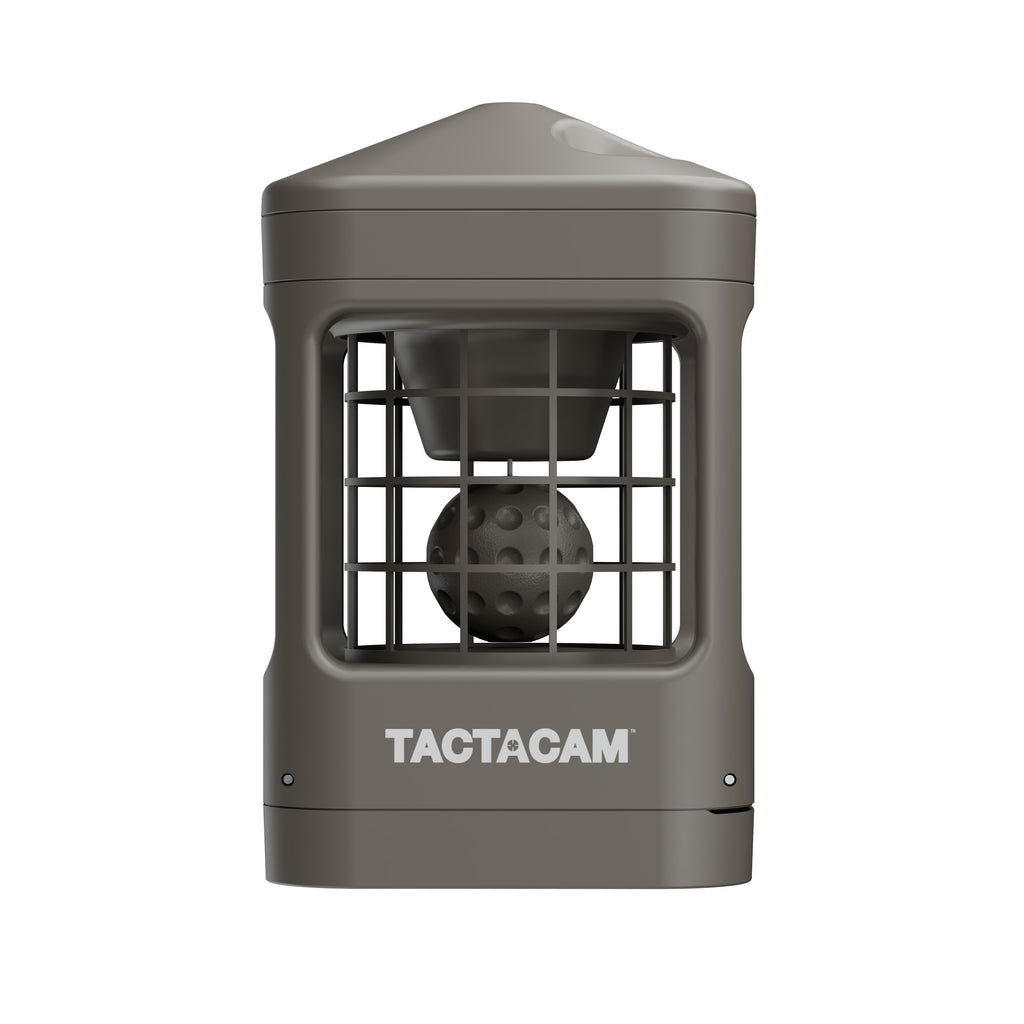 A tactical outdoor camera accessory by TACTACAM, featuring a matte dark gray housing, a front wire mesh guard, and a spherical lens inside, shown on a solid white background.